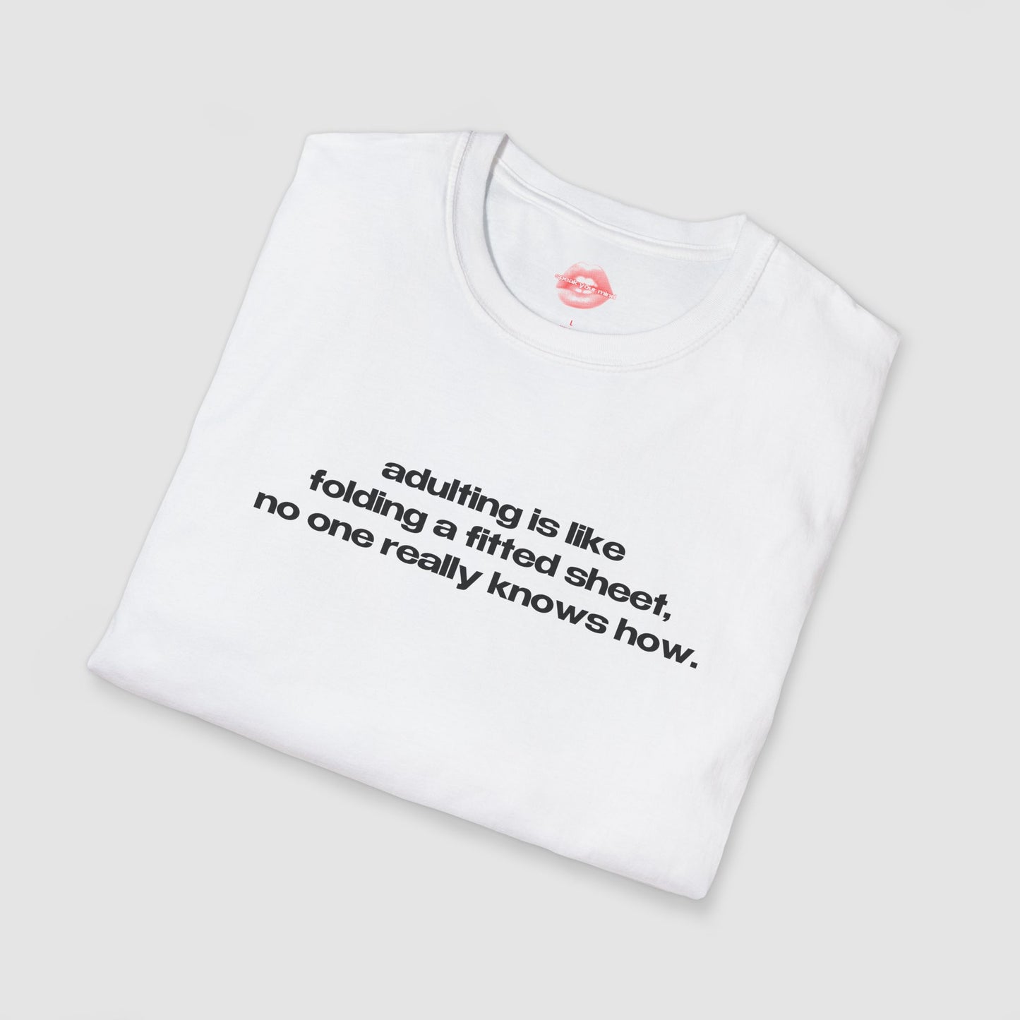 "Adulting Is Like Folding A Fitted Sheet, No One Really Knows How." | Text Only | T-Shirt
