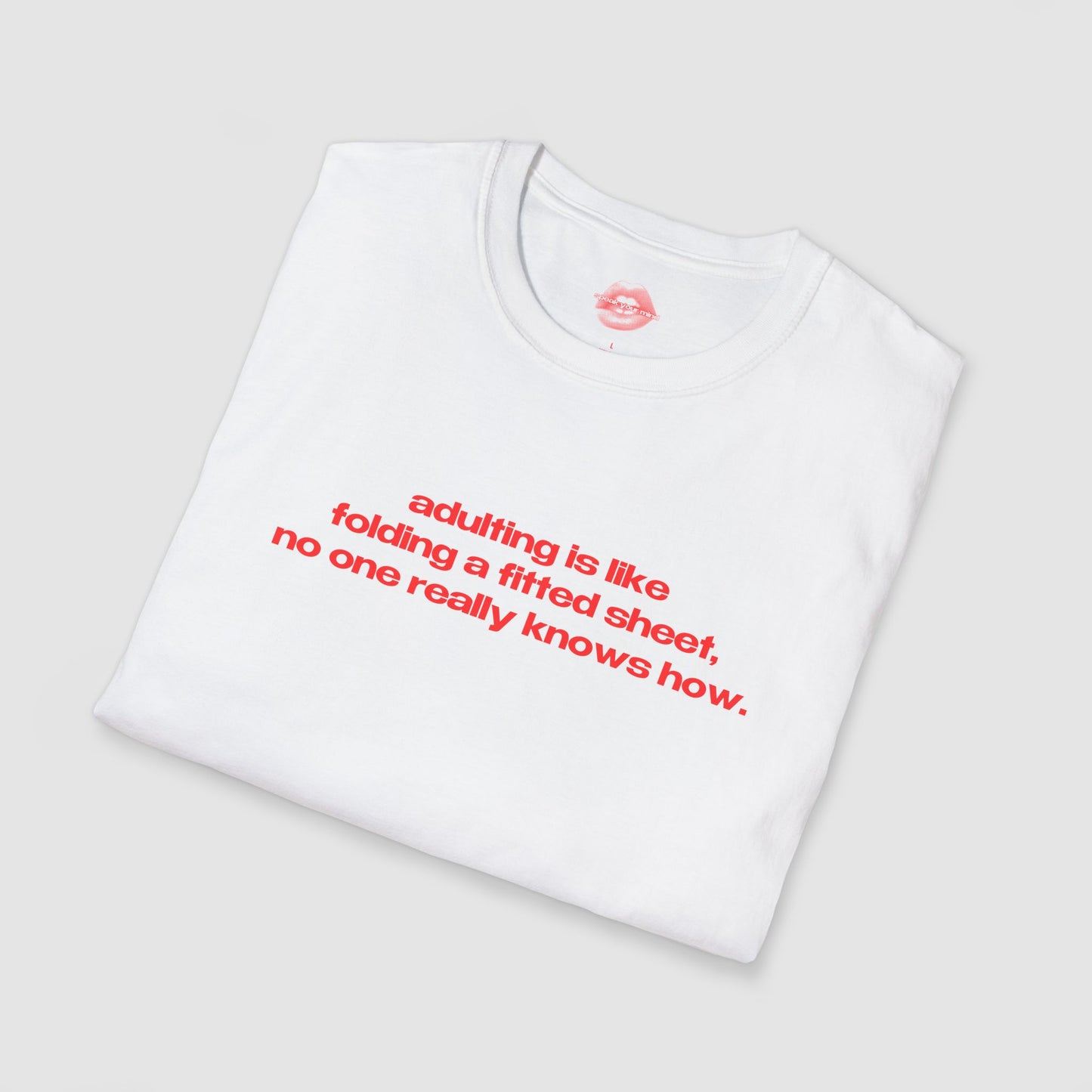 "Adulting Is Like Folding A Fitted Sheet, No One Really Knows How." | Text Only | T-Shirt