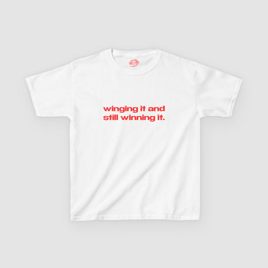 "Winging It And Still Winning It." | Text Only | Baby Tee