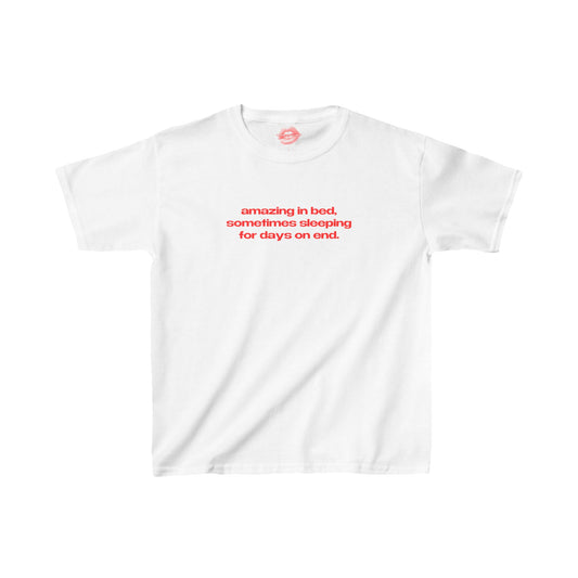 "Amazing In Bed, Sometimes Sleeping For Days On End." | Text Only | Baby Tee