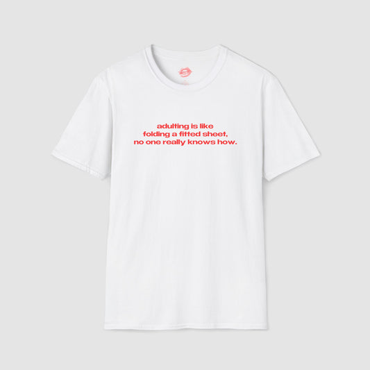"Adulting Is Like Folding A Fitted Sheet, No One Really Knows How." | Text Only | T-Shirt