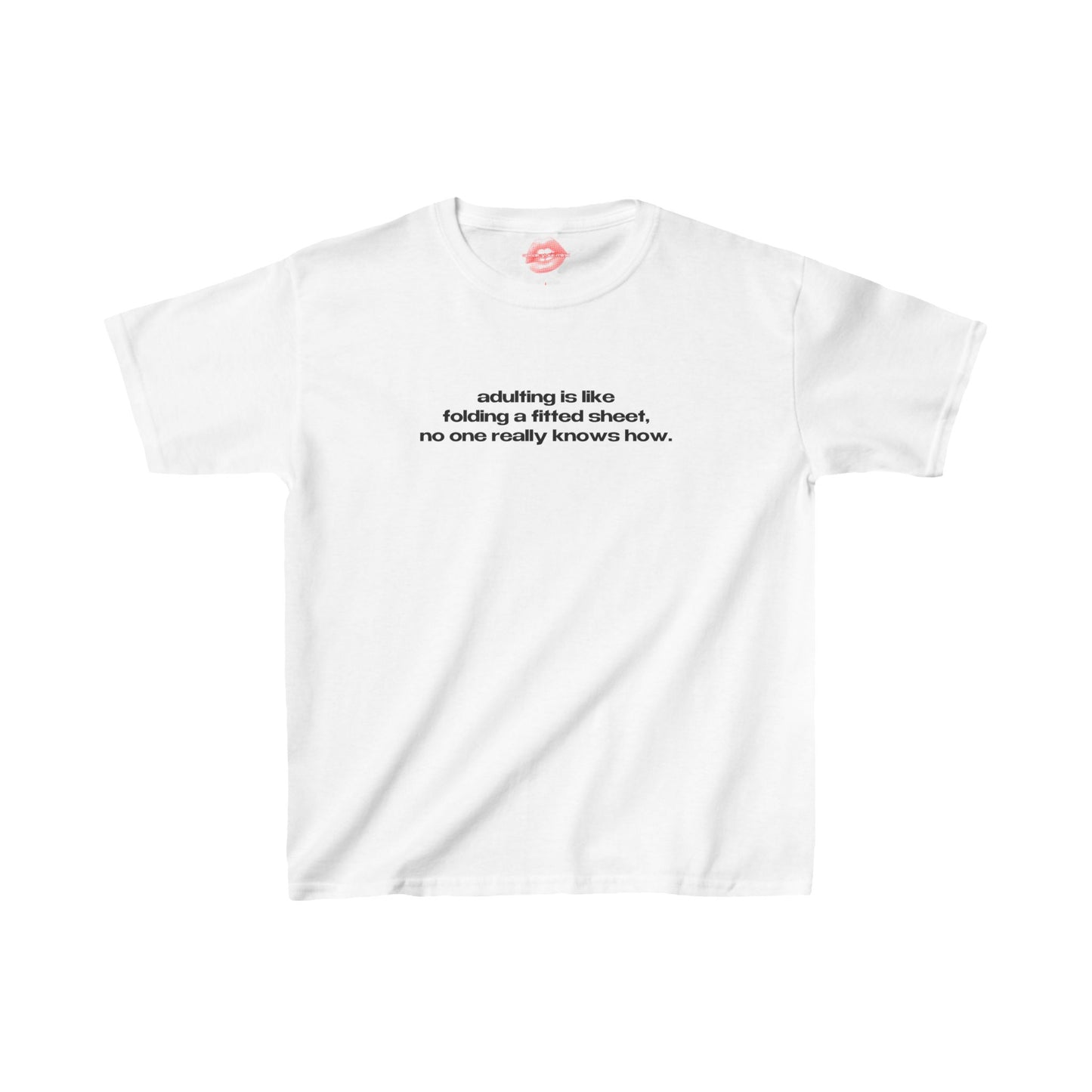 "Adulting Is Like Folding A Fitted Sheet, No One Really Knows How." | Text Only | Baby Tee