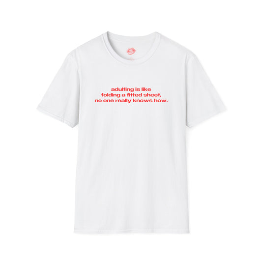 "Adulting Is Like Folding A Fitted Sheet, No One Really Knows How." | Text Only | T-Shirt