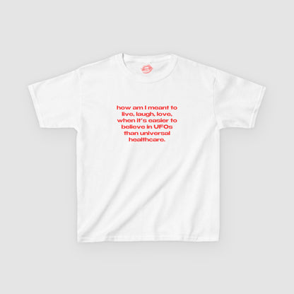 "How Am I Meant To Live, Laugh, Love, When It's Easier To Believe In UFOs Than Universal Healthcare." | Text Only | Baby Tee