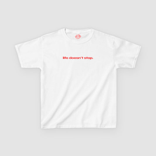"Life Doesn't Stop." | Text Only | Baby Tee